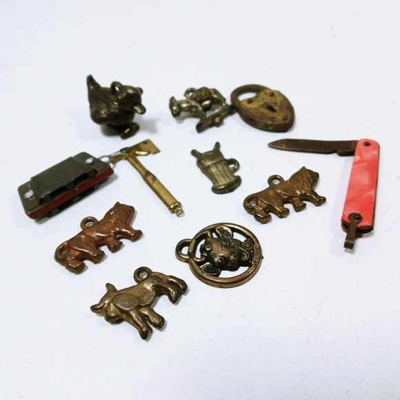 Vtg Cracker Jack Gumball Prize Metal Charms Hermonica Elsie Cow Tomahawk Teeth - Picture 1 of 9